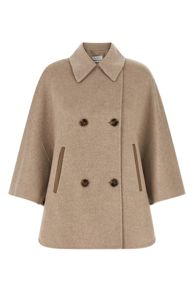 the max mara ospite cape redefines the volumes of outerwear through a flared sil