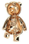 the max mara brooch in the shape of a bear defines a precious aesthetic through