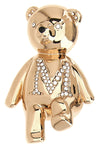 the max mara brooch in the shape of a bear defines a precious aesthetic through