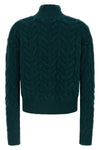 max mara studio cosmo knitwear redefines winter knitwear through complex braid