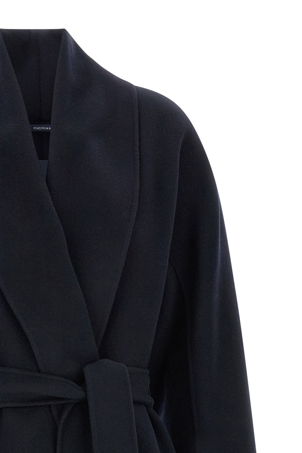 the s max mara manna coat defines a rigorous sartorial aesthetic through a de
