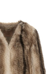 the twinset hood jacket redefines the volumes of the outerwear through a soft an
