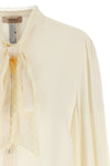 the twinset shirt redefines the codes of everyday elegance through an impeccable