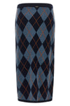 the longuette skirt twinset redefines the codes of classic knitwear through a ti