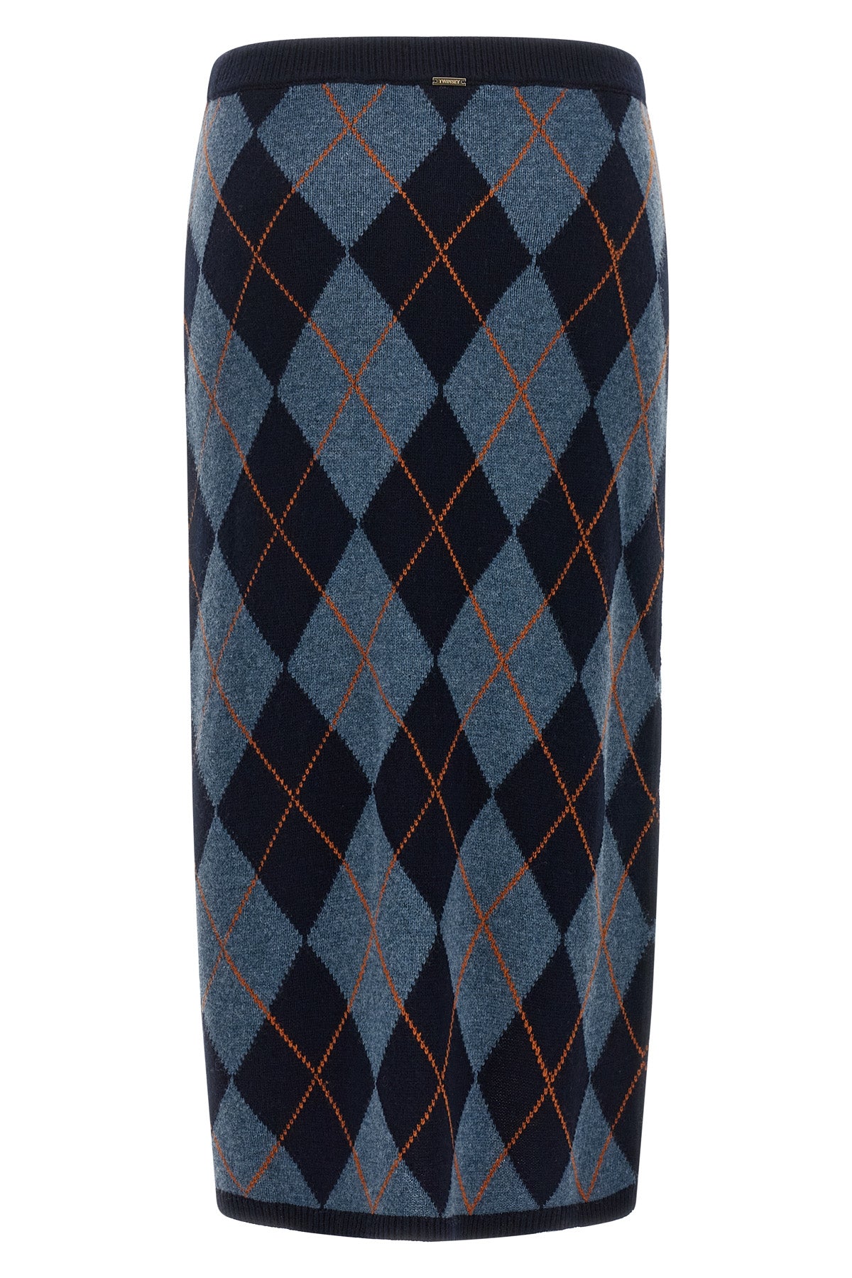the longuette skirt twinset redefines the codes of classic knitwear through a ti