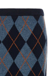the longuette skirt twinset redefines the codes of classic knitwear through a ti