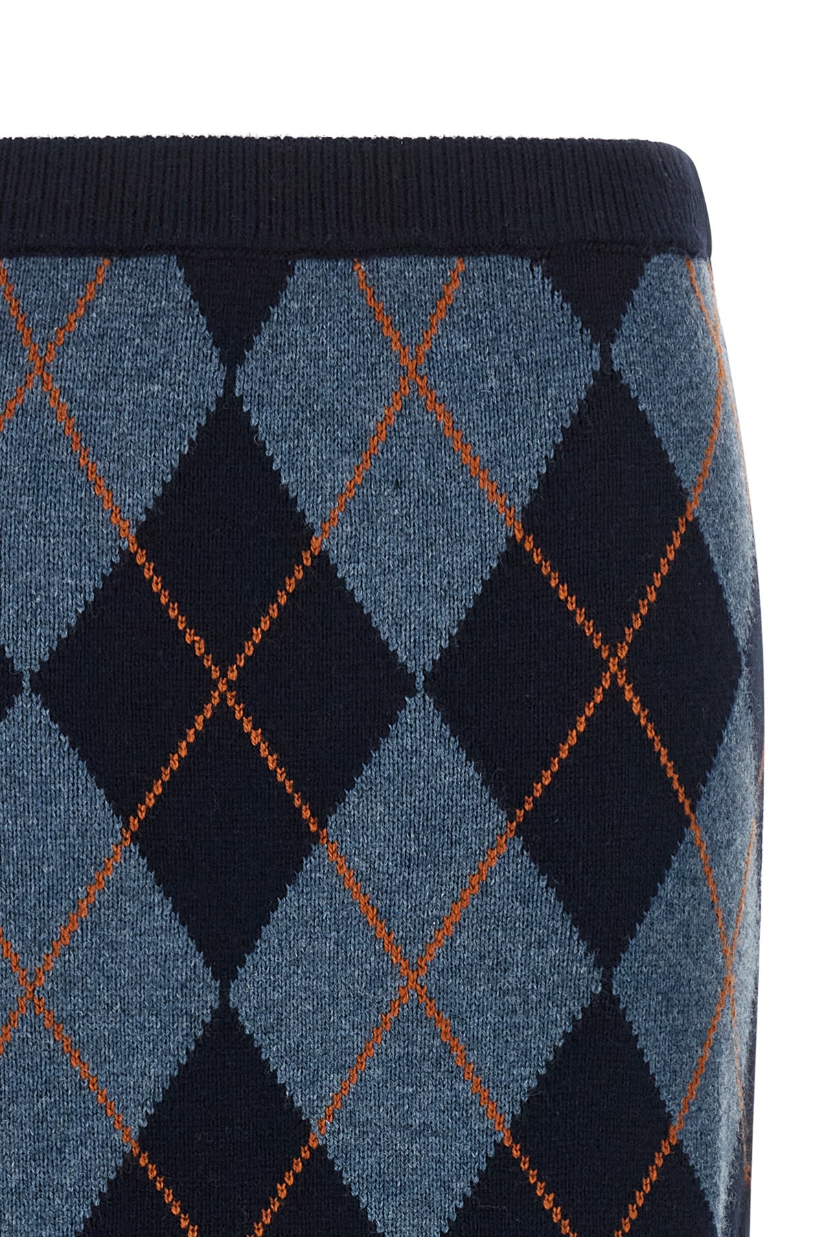 the longuette skirt twinset redefines the codes of classic knitwear through a ti