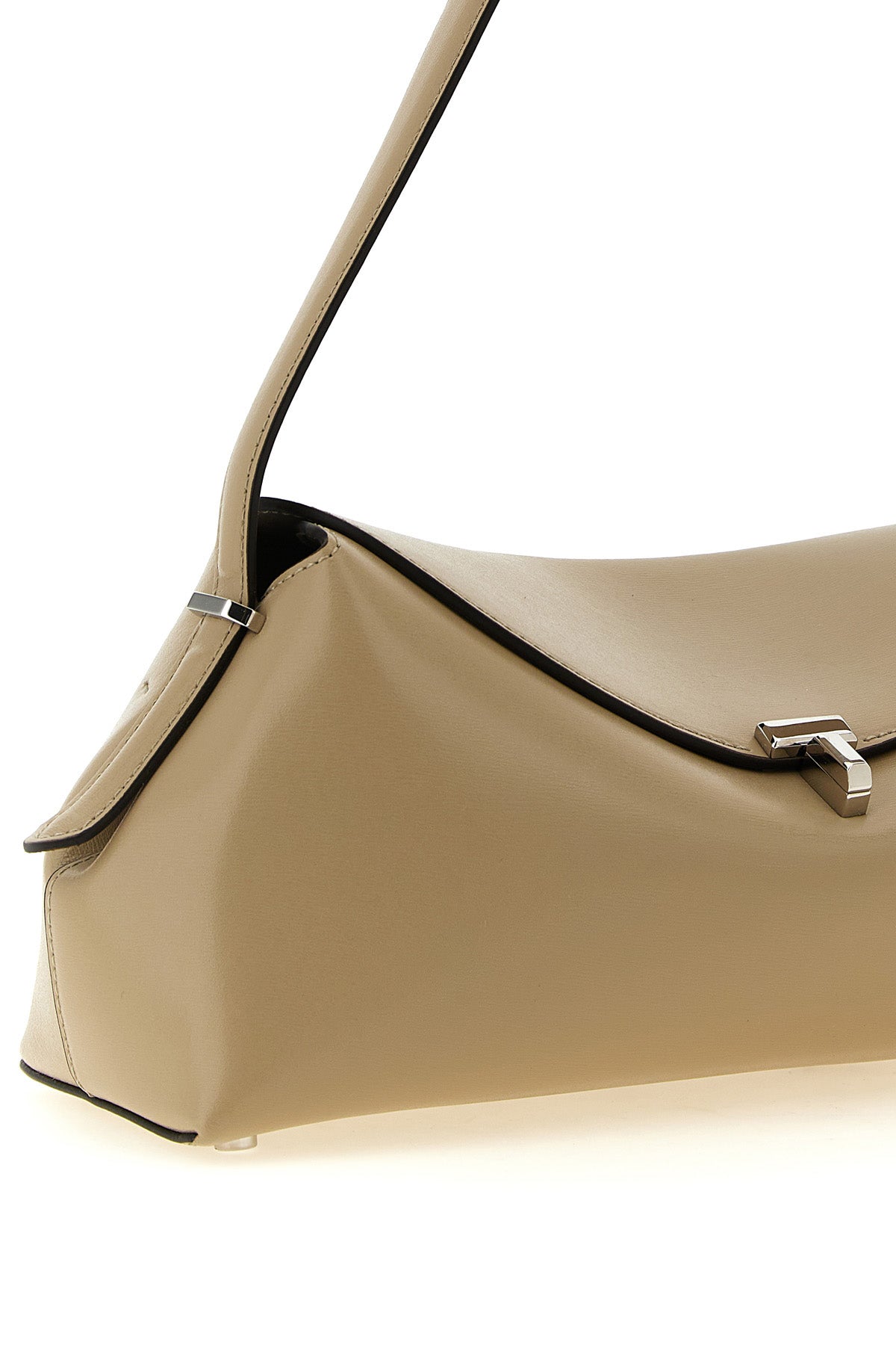 the toteme t-lock leather shoulder bag features an elongated and softly structur