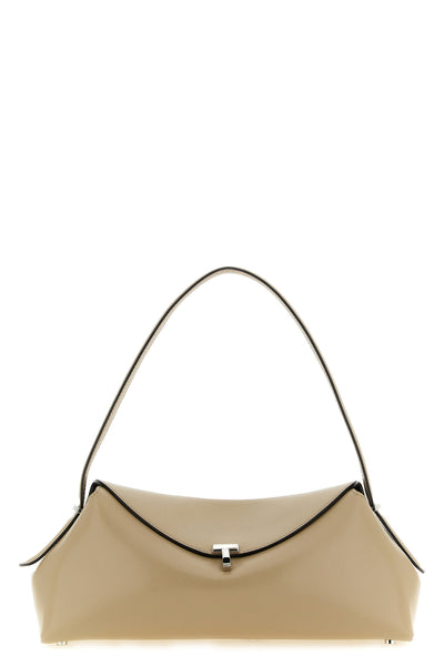 the toteme t-lock leather shoulder bag features an elongated and softly structur