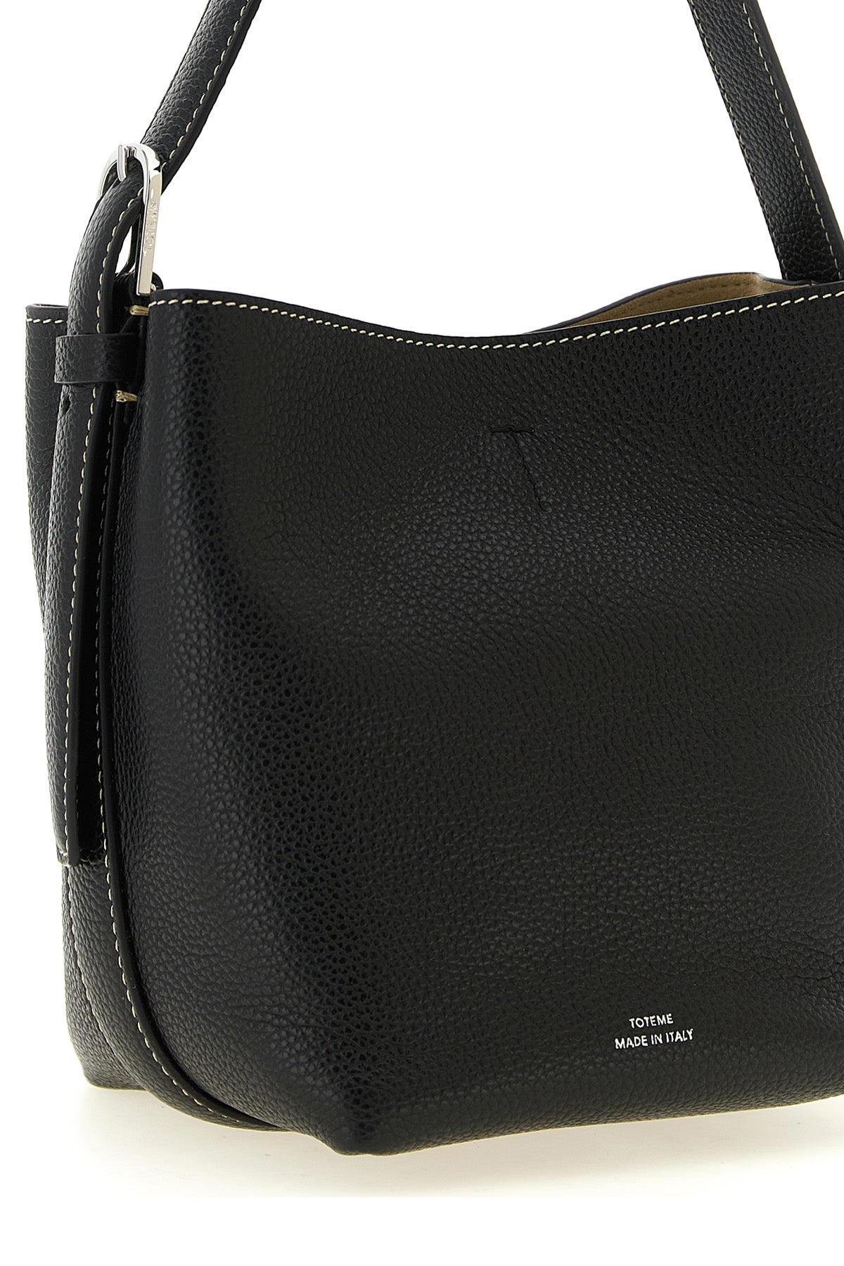the toteme small belted tote handbag in black hammered leather stands out for it