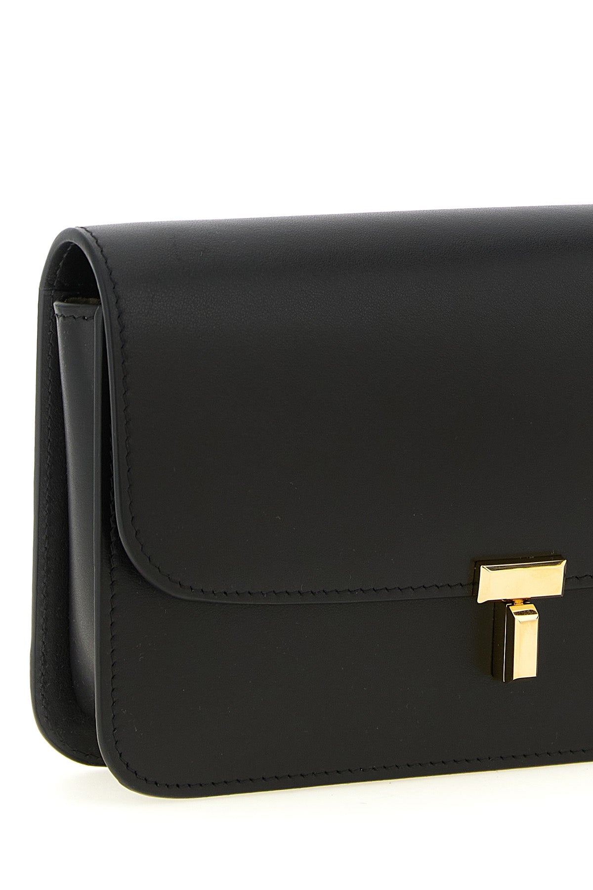 the toteme t-lock leather crossbody bag stands out for a structured construction