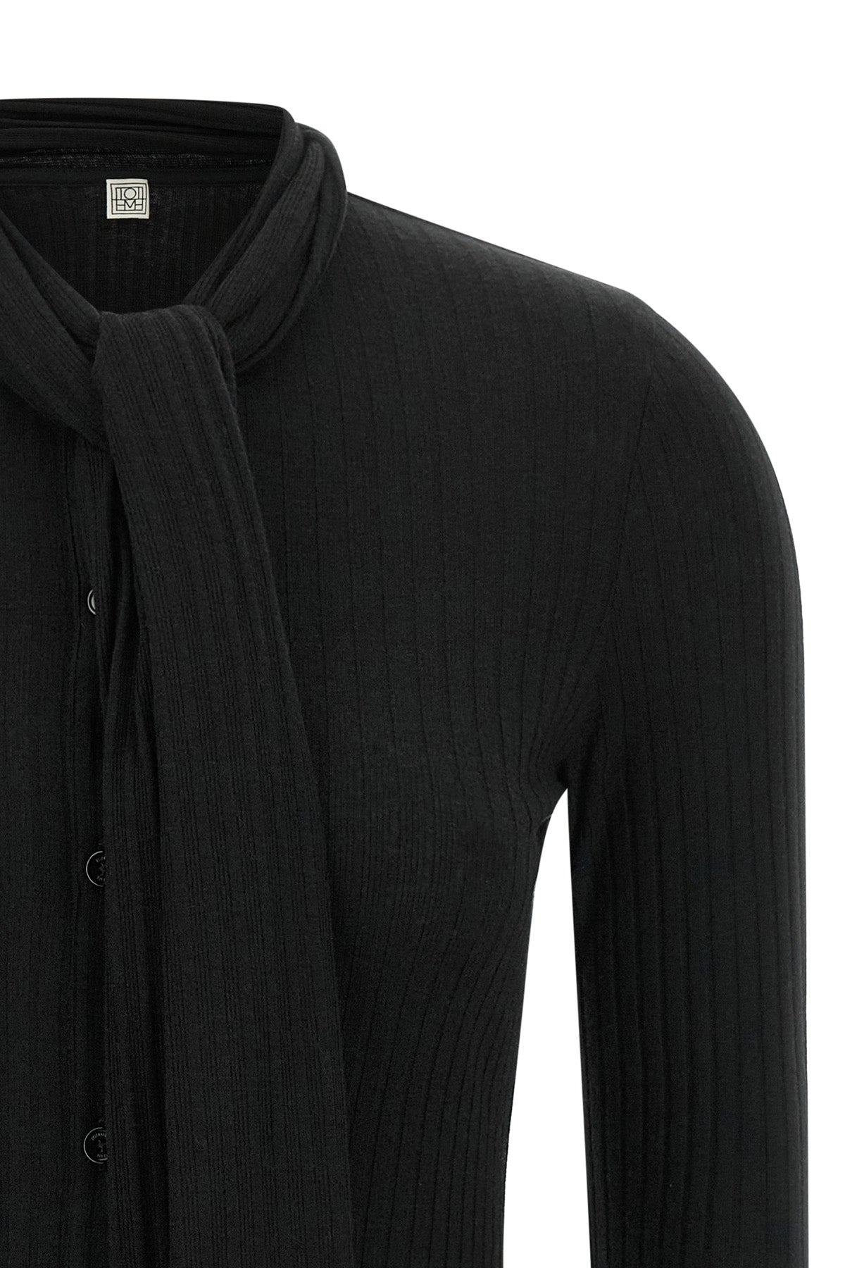 the toteme cardigan redefines everyday elegance through an essential silhouette