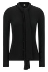 the toteme cardigan redefines everyday elegance through an essential silhouette