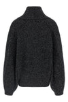 the toteme cardigan redefines the volumes of knitwear through a sculptural and e