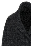 the toteme cardigan redefines the volumes of knitwear through a sculptural and e