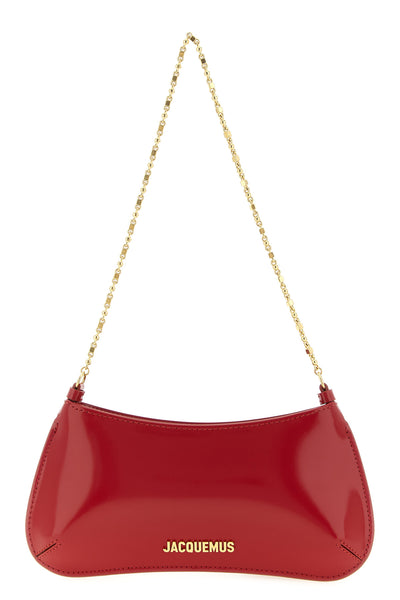 the jacquemus le petit bisou chaîne shoulder bag features a curved and structu