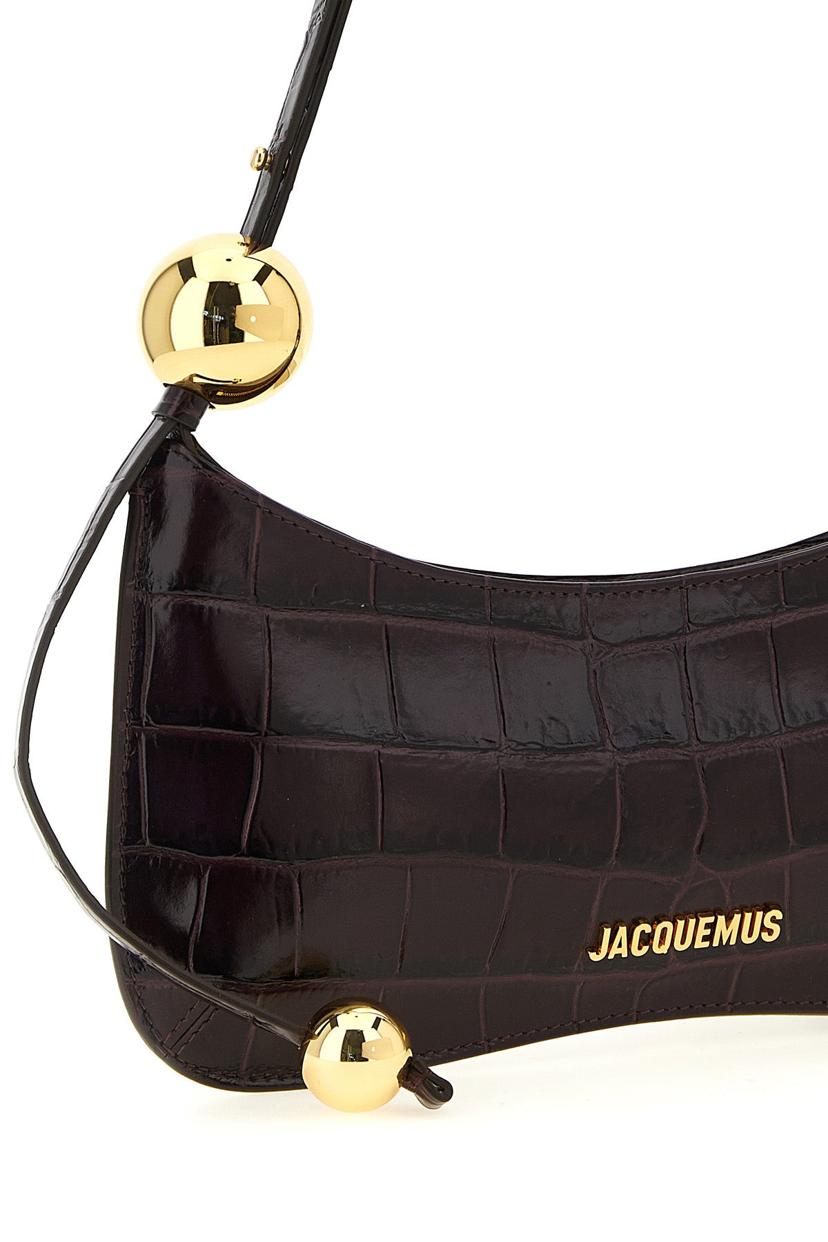 the jacquemus le bisou perle shoulder bag defines a new geometry through a cur