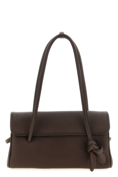 the jacquemus le turismo long shoulder bag redefines classic proportions throu