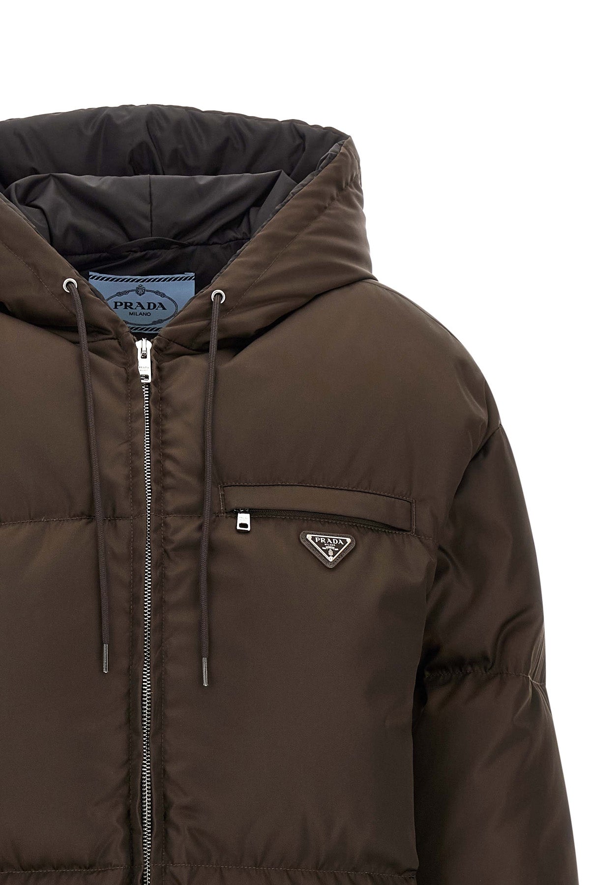 prada re-nylon down jacket redefines the codes of outerwear through an oversized