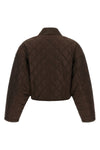prada cropped blouson defines a new functional aesthetic through compact volumes