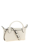 the longchamp xs le pliage xtra clutch redefines the codes of everyday eleganc