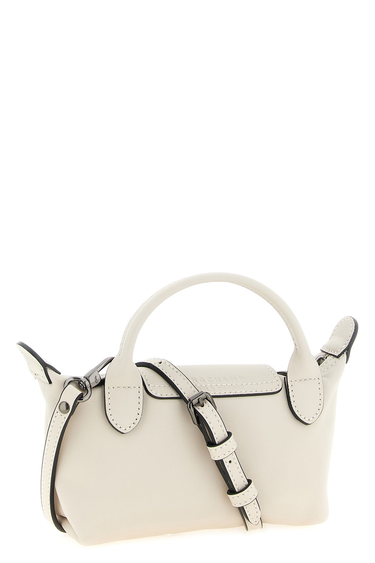 the longchamp xs le pliage xtra clutch redefines the codes of everyday eleganc