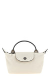 the longchamp xs le pliage xtra clutch redefines the codes of everyday eleganc