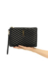 cassandre matelassé leather clutch bag
