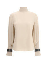 BRUNELLO CUCINELLI S silk turtleneck blouse with precious bracelets
