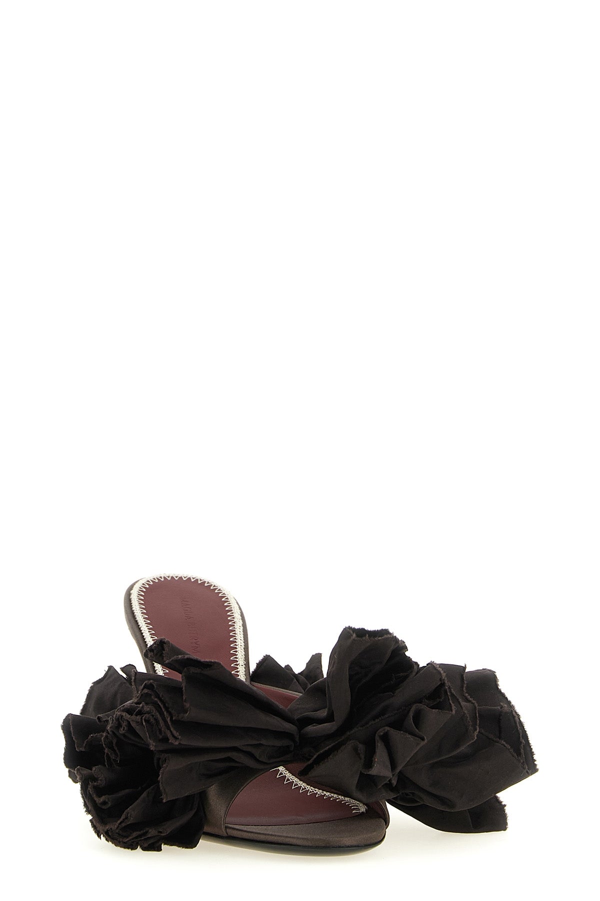 magda butrym mules redefine evening elegance through sculptural volumes and sart
