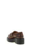 miu miu loafers redefine classic footwear through a structural and bold lens