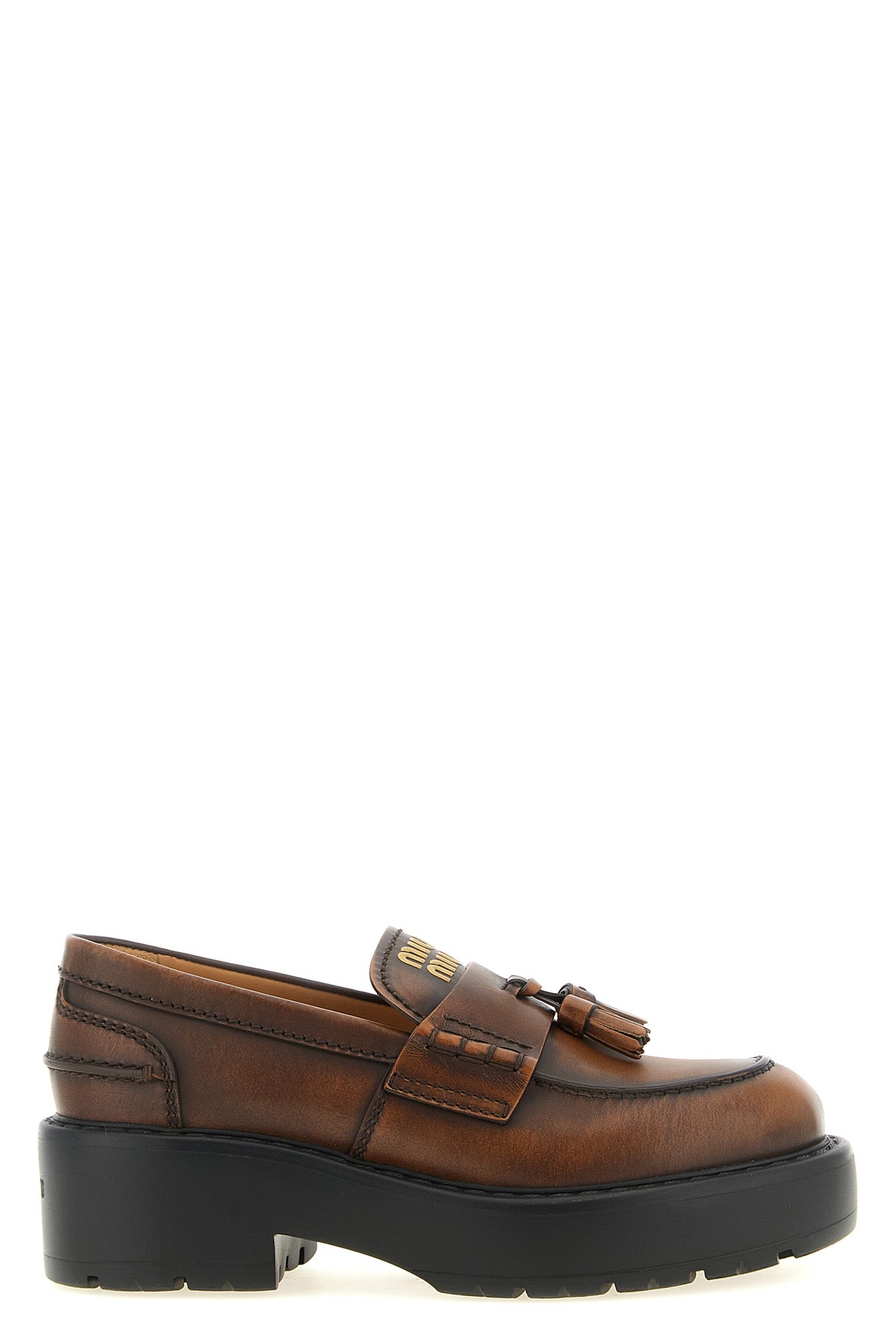 miu miu loafers redefine classic footwear through a structural and bold lens
