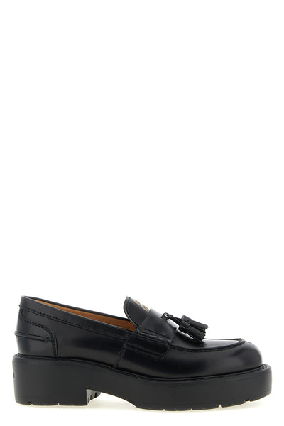 miu miu loafers in fine black calf leather reinterpret a wardrobe classic throug