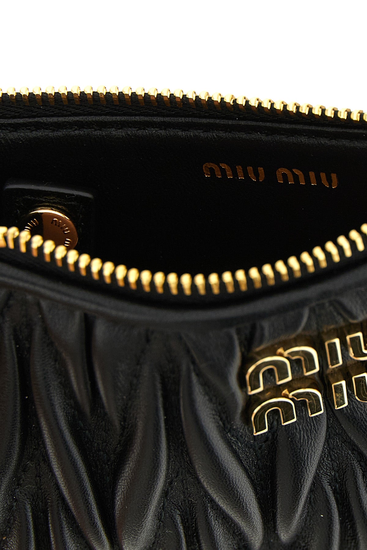 the miu miu matelassé nappa leather card holder represents an expression of pure