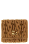 the miu miu small wallet in matelassé nappa leather represents the essence of th