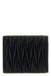 the miu miu small wallet in matelassé nappa leather is an essential accessory