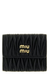 the miu miu small wallet in matelassé nappa leather is an essential accessory