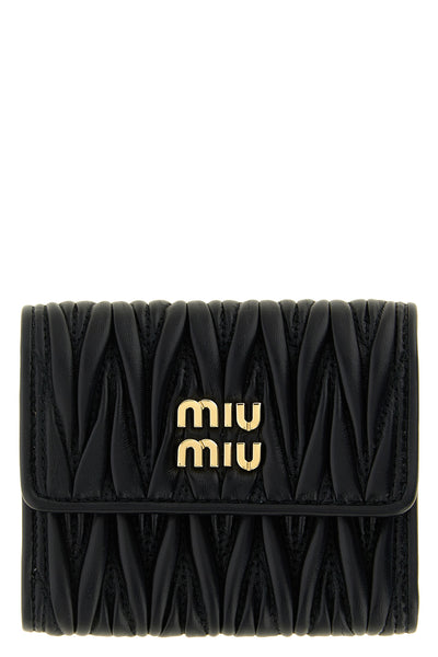 the miu miu small wallet in matelassé nappa leather is an essential accessory