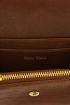 the miu miu small wallet in soft lambskin leather stands out for its compact and