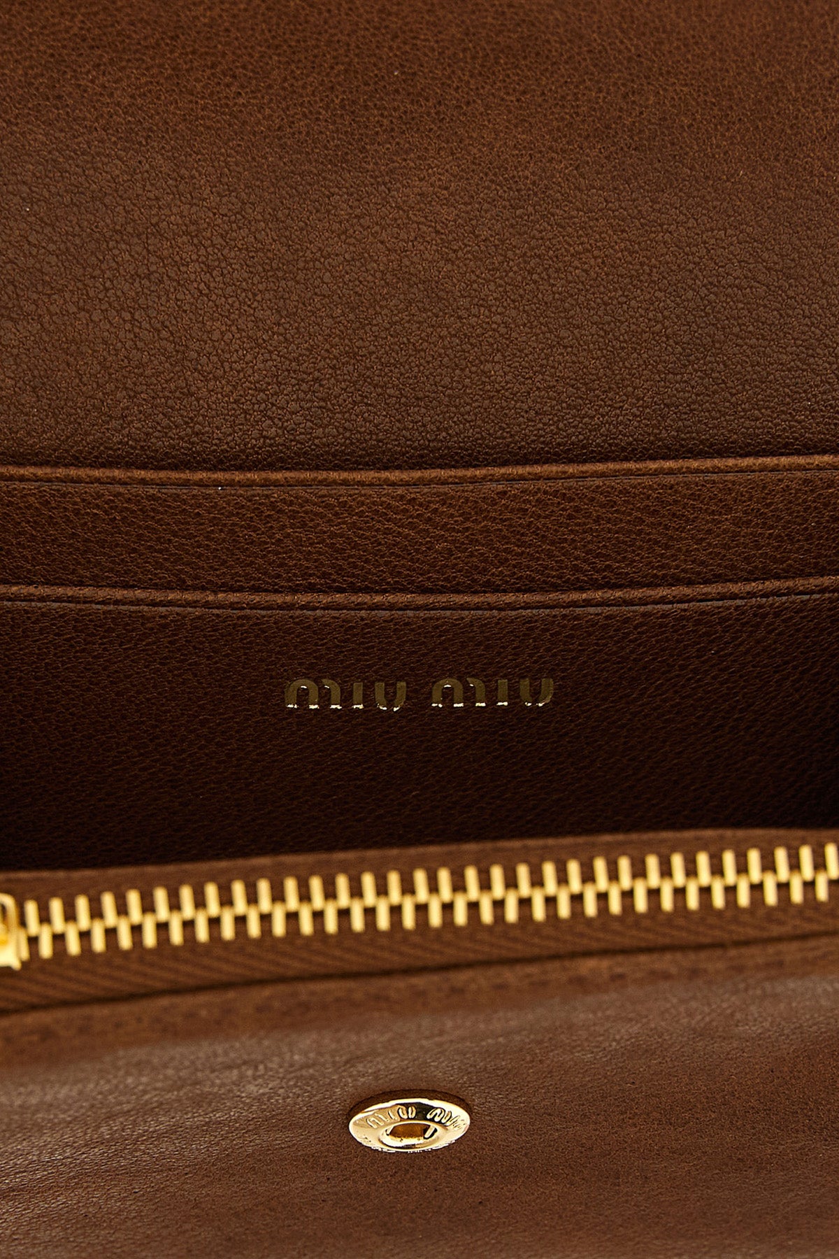 the miu miu small wallet in soft lambskin leather stands out for its compact and
