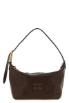 the miu miu aviator nappa pouch defines a compact hobo silhouette