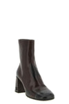 miu miu ankle boots redefine everyday elegance through a structured silhouette i