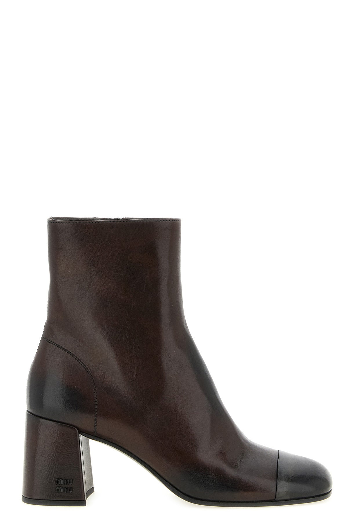 miu miu ankle boots redefine everyday elegance through a structured silhouette i