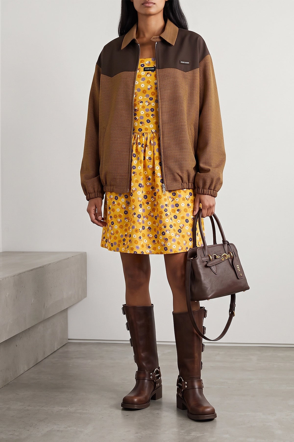 the miu miu sienna leather boot defines the silhouette through a knee structur