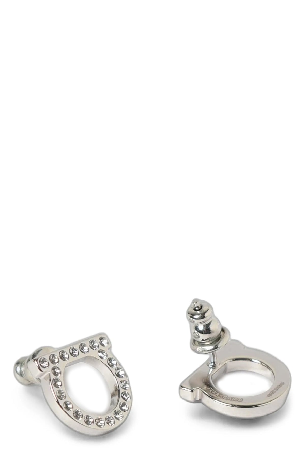 ferragamo gancini crystals earrings define the brands aesthetic through an ic