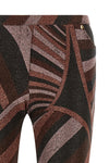 the pucci trousers define a tight silhouette that opens into an elegant flared b