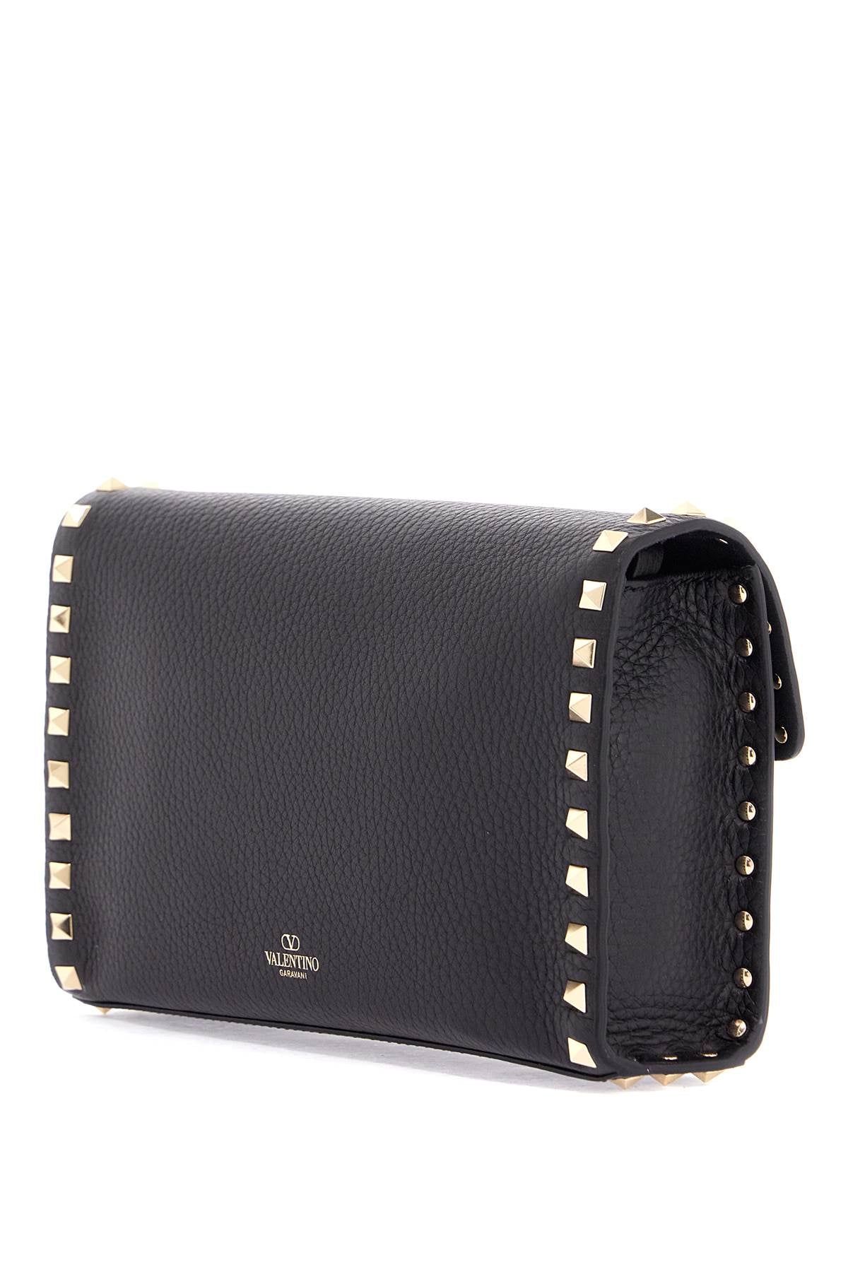 small black leather shoulder bag with golden studs