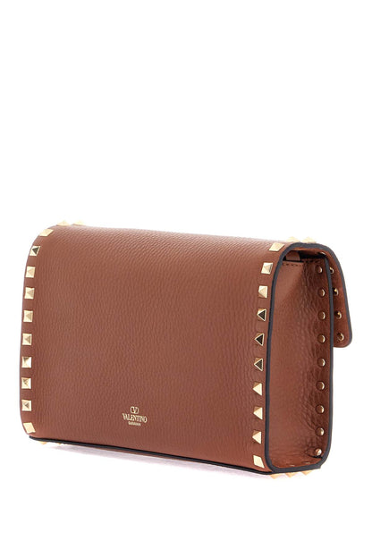 small brown leather shoulder bag with studs