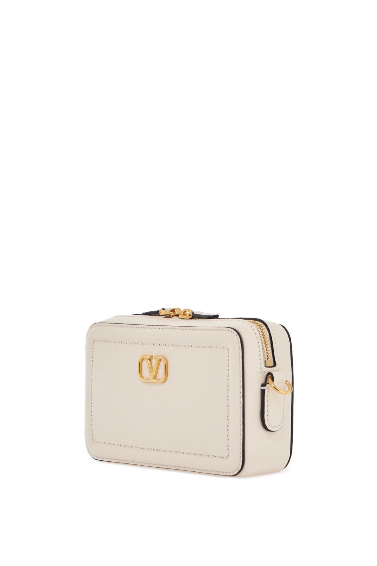 mini camera case in ivory leather with adjustable strap and golden details