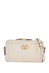 mini camera case in ivory leather with adjustable strap and golden details